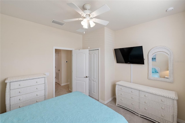 bedroom featuring baseboards, visible vents, ceiling fan, a closet, and carpet flooring