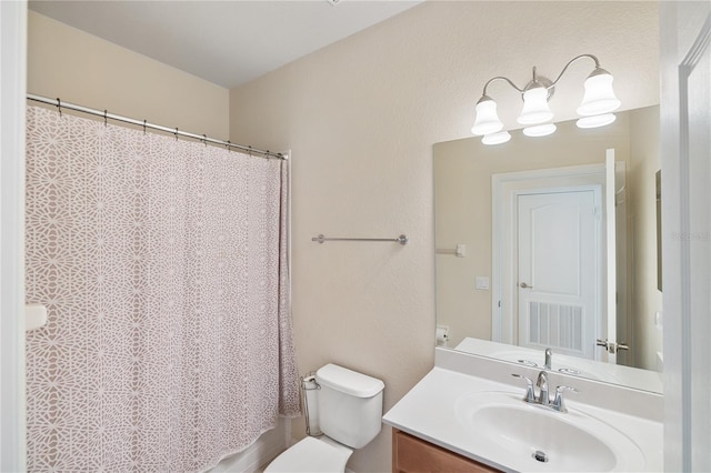 full bathroom featuring visible vents, toilet, and vanity