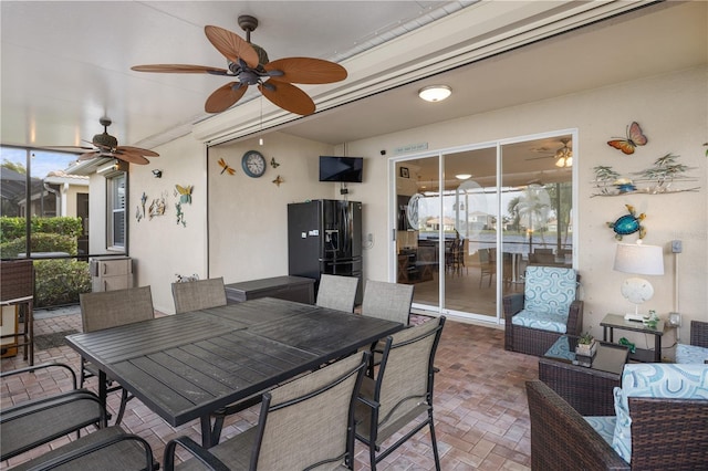 view of patio / terrace featuring outdoor dining space and a ceiling fan