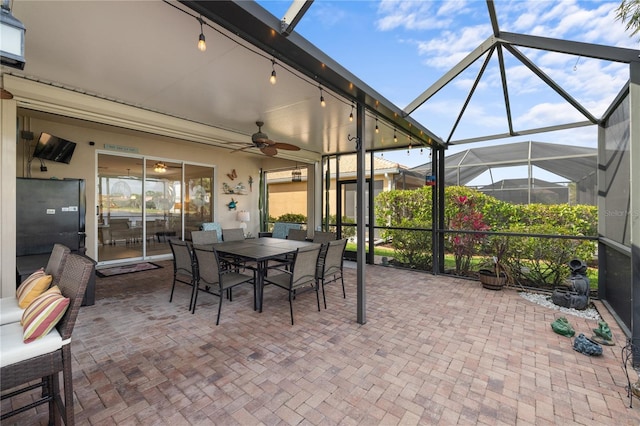 sunroom with a ceiling fan