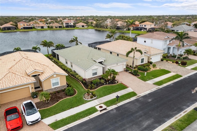 bird's eye view with a residential view and a water view