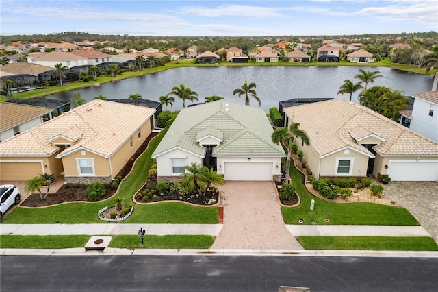 drone / aerial view with a residential view and a water view