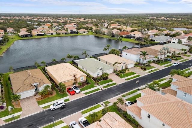 bird's eye view featuring a residential view and a water view