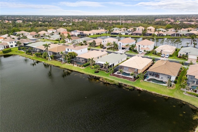 aerial view with a residential view and a water view