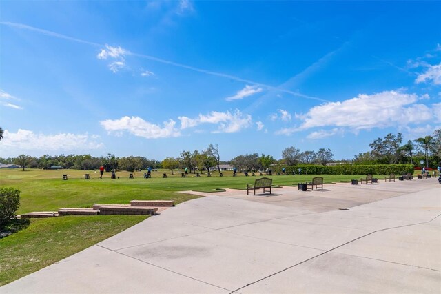 view of home's community featuring a lawn