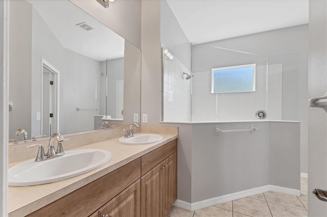 full bath with a sink, visible vents, tile patterned floors, and a walk in shower