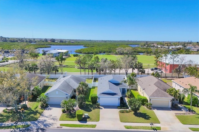 birds eye view of property featuring a residential view and a water view