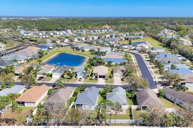 bird's eye view with a residential view and a water view