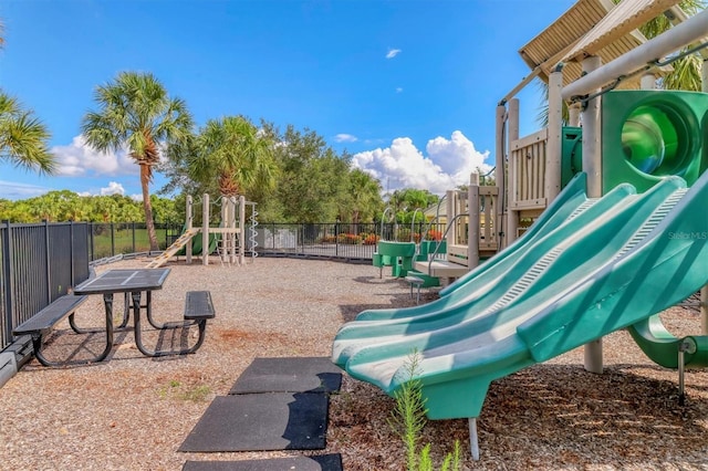 communal playground featuring fence