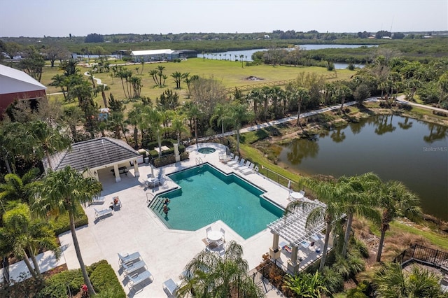 birds eye view of property with a water view