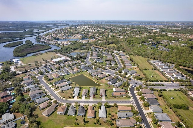 birds eye view of property with a residential view and a water view