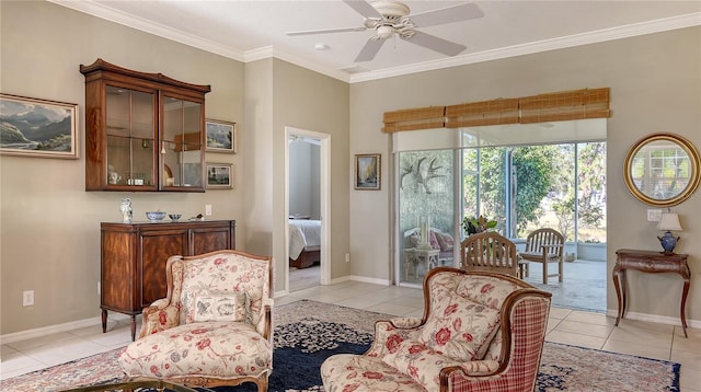 living area with crown molding, light tile patterned flooring, baseboards, and ceiling fan