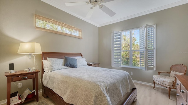 bedroom featuring crown molding, light wood-style floors, baseboards, and ceiling fan