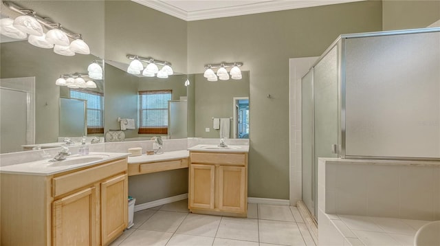 bathroom featuring a sink, a shower stall, tile patterned flooring, and ornamental molding