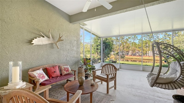 sunroom with a ceiling fan