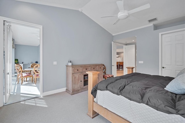 bedroom with visible vents, crown molding, baseboards, vaulted ceiling, and carpet floors