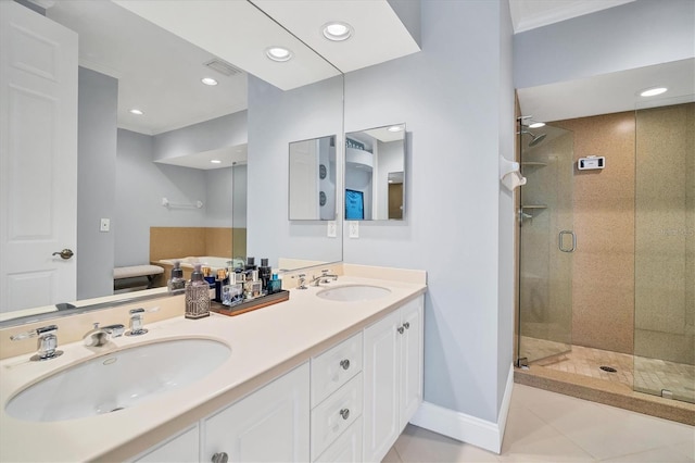 full bath with a sink, baseboards, a stall shower, and crown molding