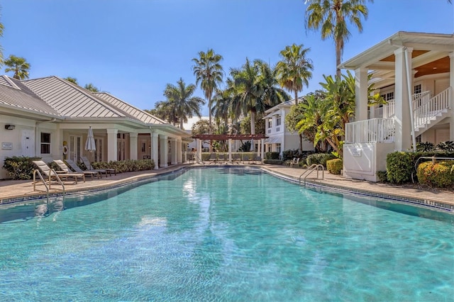 pool featuring a patio area and a pergola