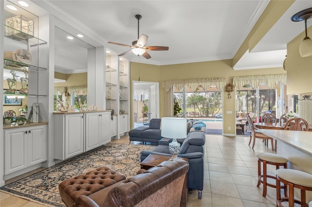 living area featuring crown molding, ceiling fan, built in features, light tile patterned floors, and recessed lighting