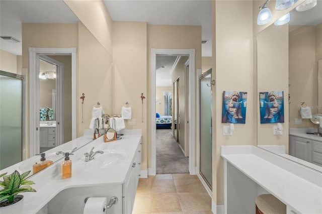 bathroom featuring vanity, baseboards, a shower stall, ensuite bathroom, and tile patterned floors