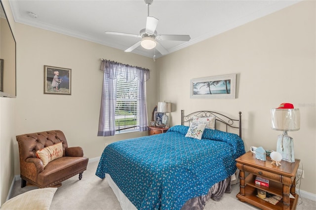 carpeted bedroom featuring a ceiling fan, crown molding, and baseboards