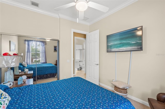 carpeted bedroom featuring a closet, visible vents, baseboards, and ornamental molding