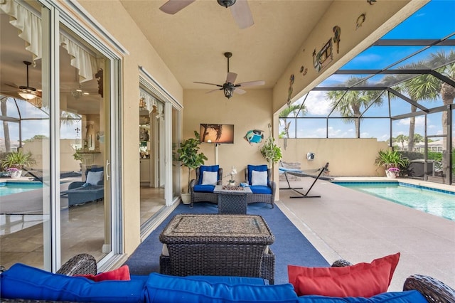 view of patio / terrace featuring outdoor lounge area, glass enclosure, a fenced in pool, and ceiling fan