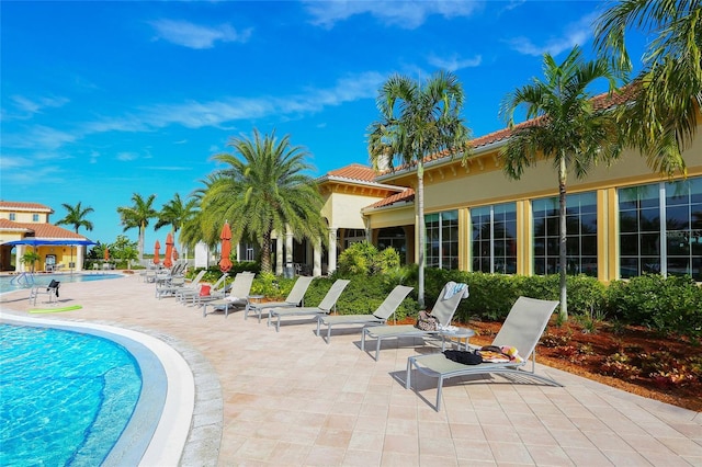 community pool with a patio