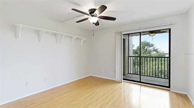 empty room with baseboards, light wood-style flooring, and a ceiling fan