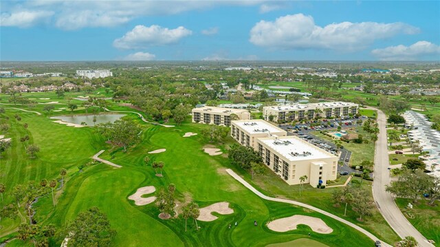 aerial view featuring a water view, a city view, and golf course view