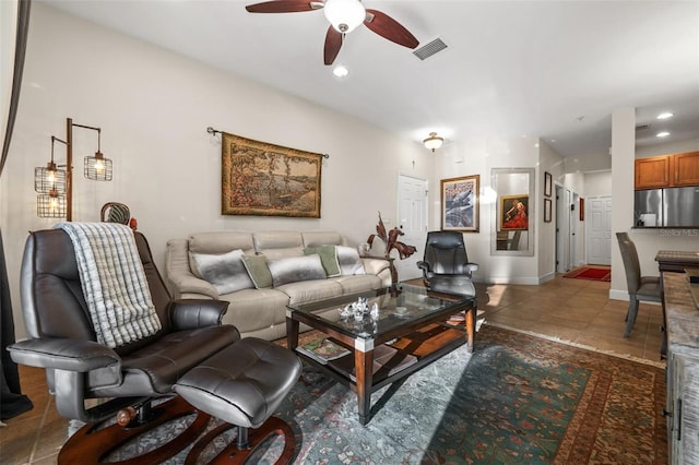 living area featuring visible vents, baseboards, recessed lighting, tile patterned floors, and a ceiling fan