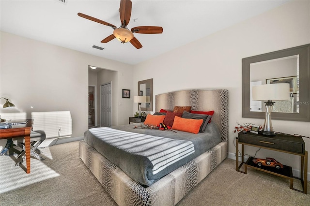 bedroom with a ceiling fan, visible vents, carpet, baseboards, and a closet