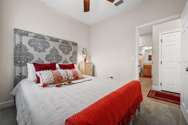 bedroom featuring a ceiling fan, baseboards, visible vents, and tile patterned flooring