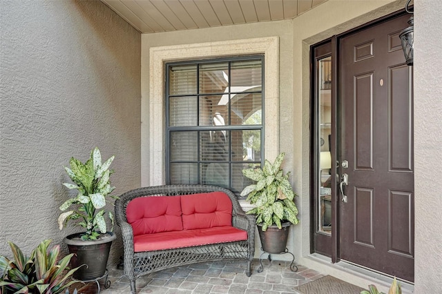 doorway to property with stucco siding