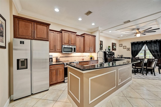 kitchen with tasteful backsplash, light tile patterned floors, visible vents, and appliances with stainless steel finishes