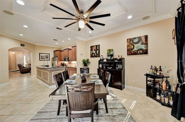 dining space featuring baseboards, light tile patterned flooring, recessed lighting, arched walkways, and ceiling fan