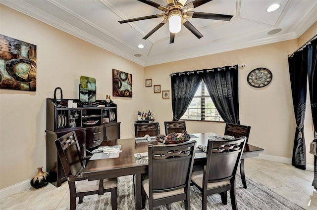 dining room with light tile patterned floors, a ceiling fan, baseboards, and ornamental molding