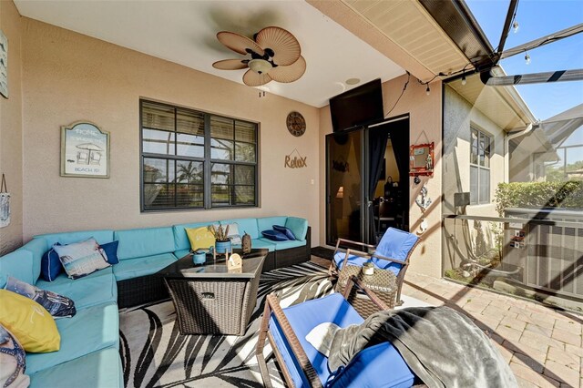 view of patio featuring an outdoor living space, cooling unit, a ceiling fan, and a lanai