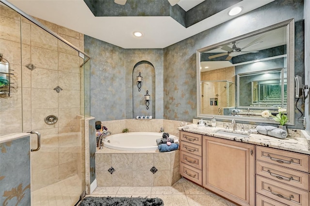 full bathroom featuring tile patterned floors, a stall shower, ceiling fan, a bath, and vanity