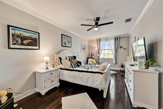 bedroom with dark wood-style floors, a ceiling fan, crown molding, and baseboards