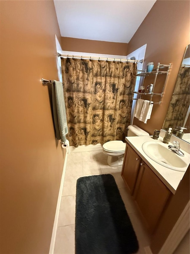 bathroom with vanity, a shower with curtain, tile patterned flooring, vaulted ceiling, and toilet