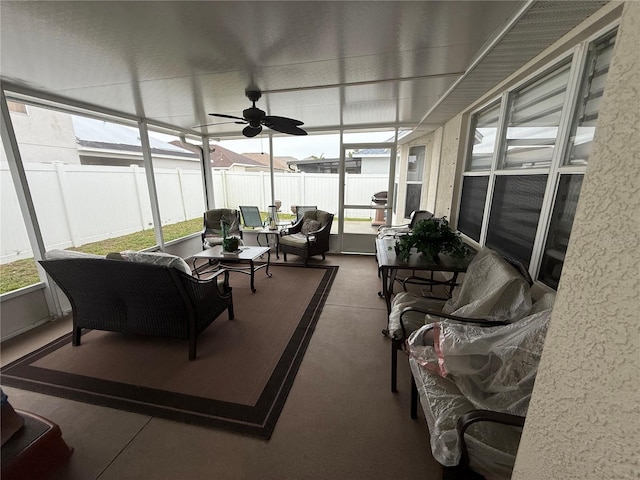 sunroom featuring ceiling fan