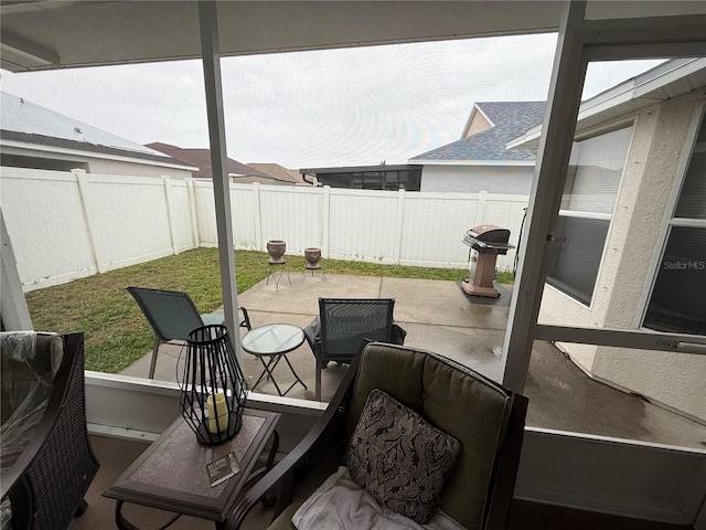 view of patio / terrace featuring outdoor dining space, a fenced backyard, and a grill