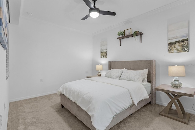 carpeted bedroom with ceiling fan, crown molding, and baseboards