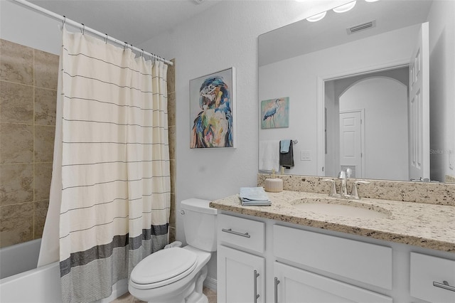 bathroom featuring visible vents, shower / bath combination with curtain, toilet, and vanity