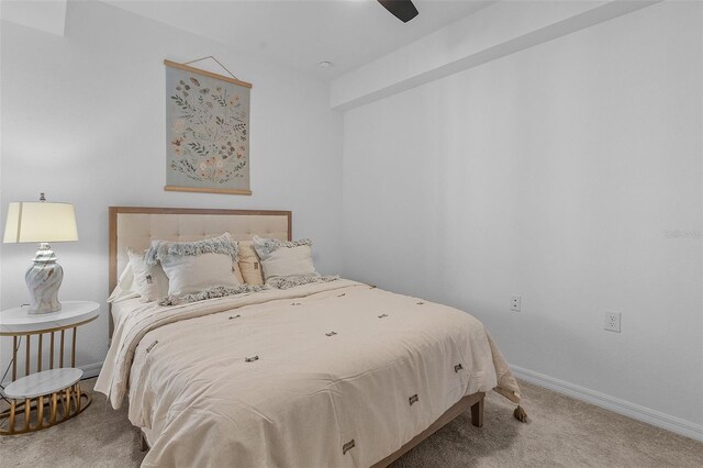 bedroom featuring carpet flooring, a ceiling fan, and baseboards