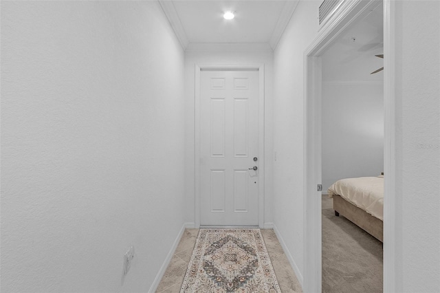 hallway featuring baseboards and ornamental molding