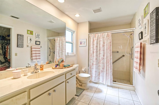 bathroom featuring visible vents, vanity, and a shower stall