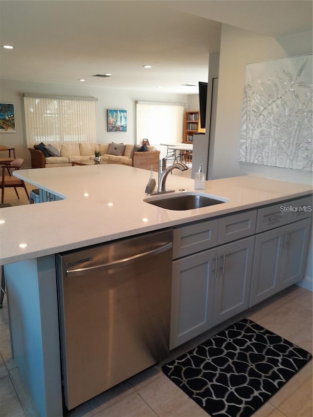 kitchen with light tile patterned flooring, recessed lighting, a sink, dishwasher, and open floor plan