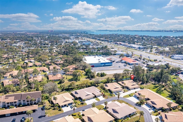 birds eye view of property with a residential view and a water view